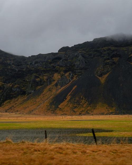 Majestic view of Iceland's rugged hills on a cloudy day, showcasing nature's raw beauty.