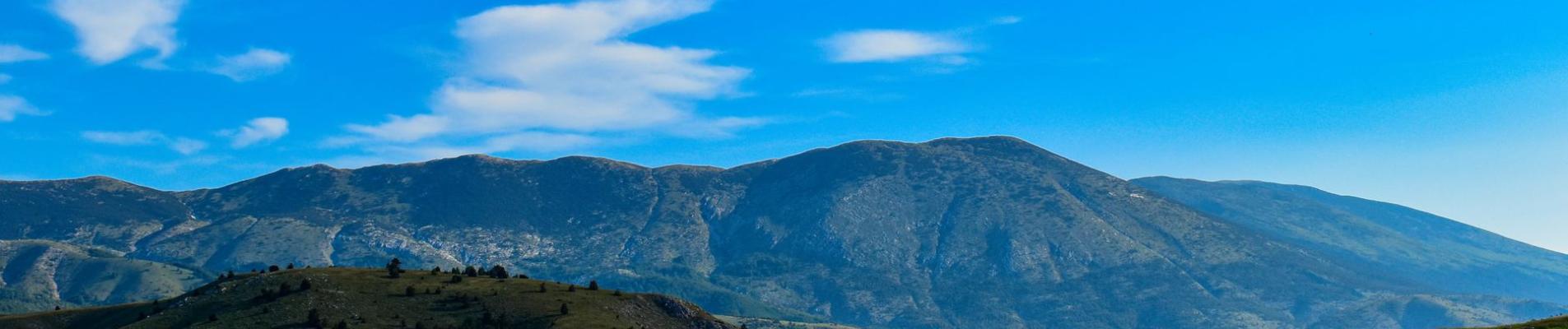 Serene landscape featuring mountains and blue sky in Bosnia and Herzegovina.