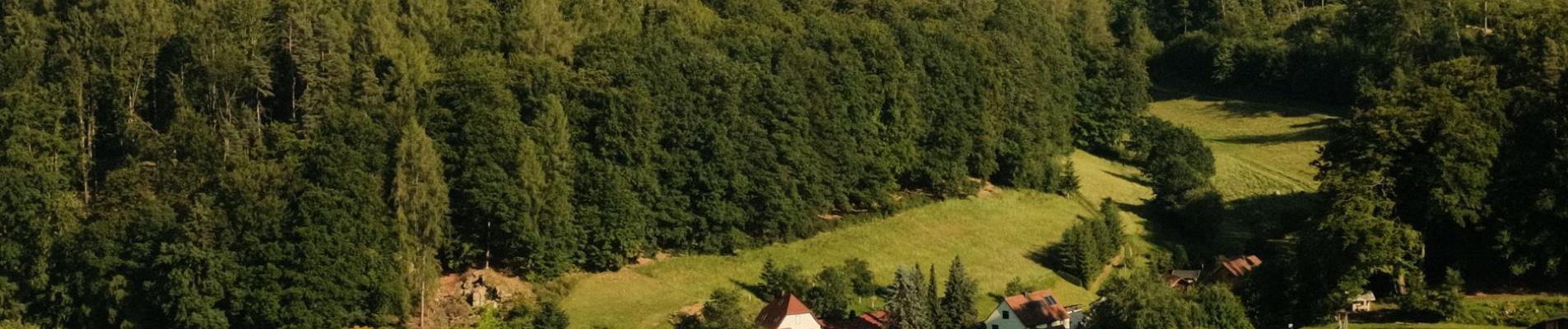 Picturesque village nestled in a green forested landscape in Schmalkalden, Germany.