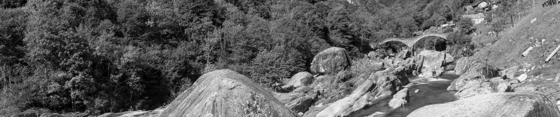 Monochrome landscape of rocks and river in Verzasca Valley, Switzerland.