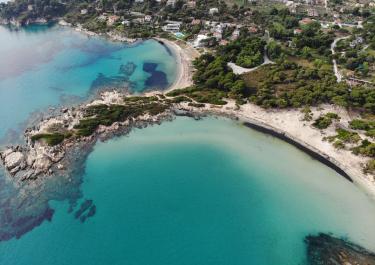 Discover the stunning beaches and vibrant sea of Sithonia, Halkidiki, Greece from above.