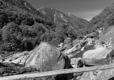 Monochrome landscape of rocks and river in Verzasca Valley, Switzerland.